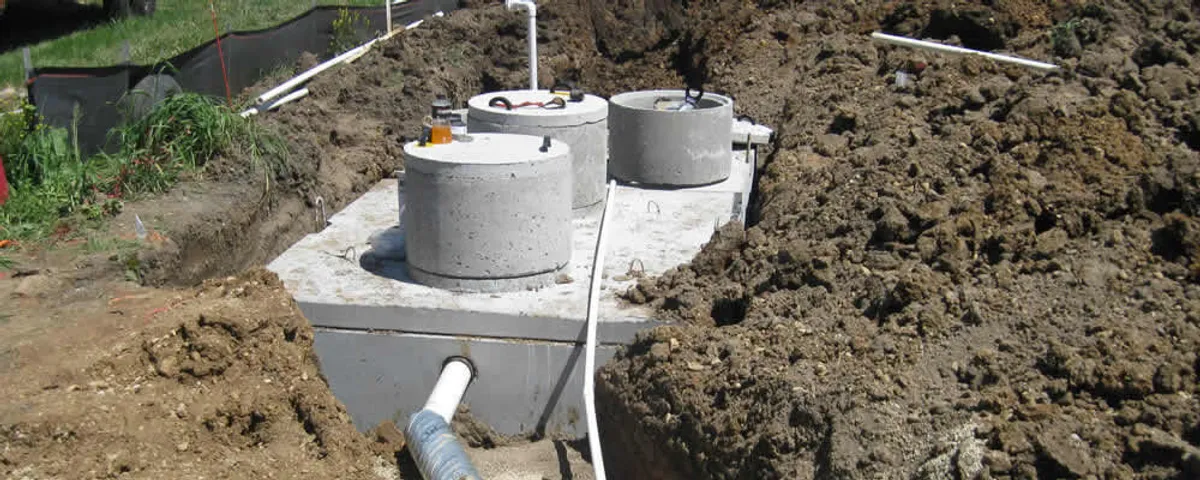 Septic system repair and installation site with tank access ports in Houston, TX